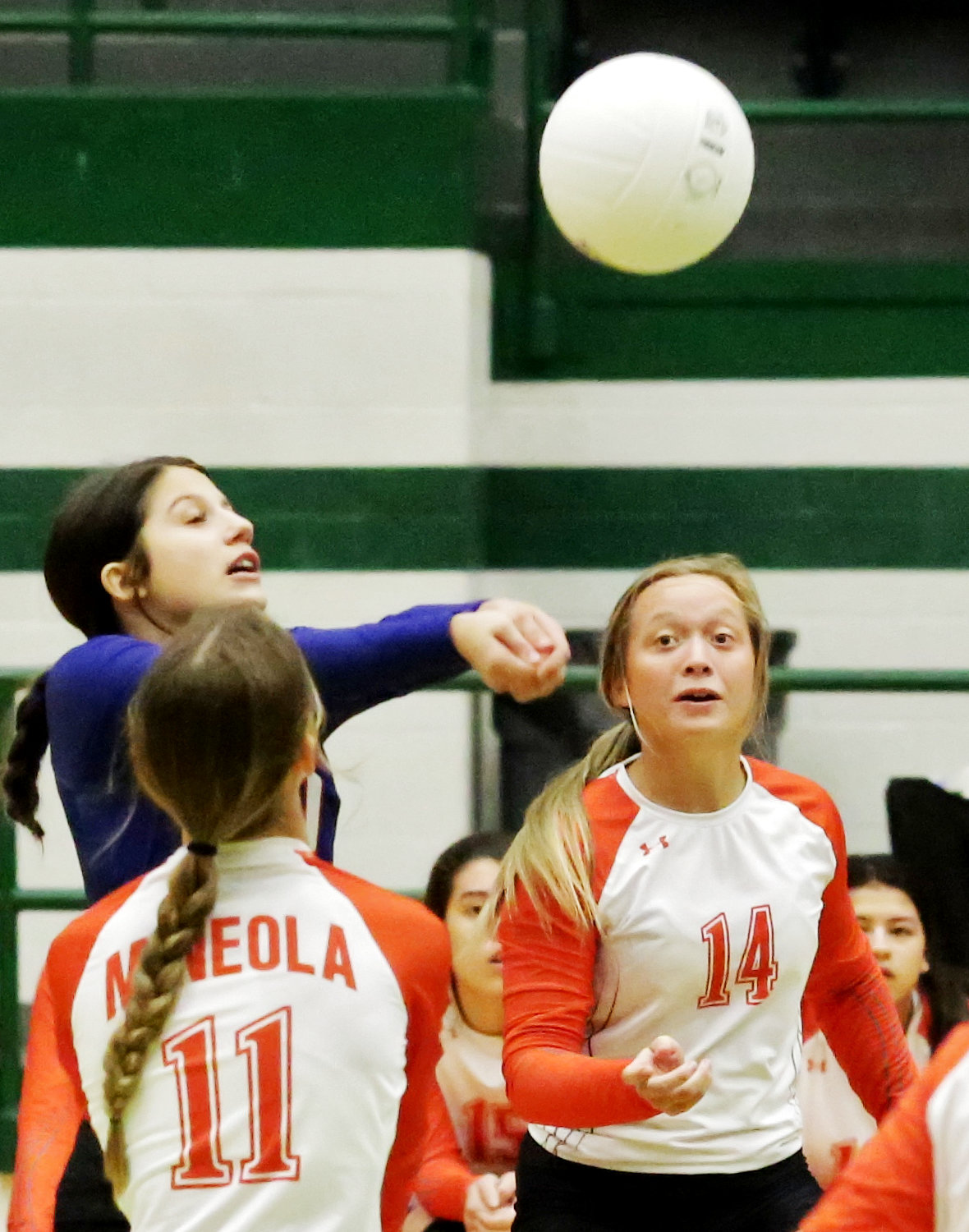 Kenleigh Aguirre makes a play on the ball between Lady Jackets Olivia Hughes (left) and Riley Weekly.